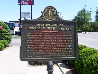 [Birth of Kentucky Fried Chicken roadside marker with details of the beginings.]